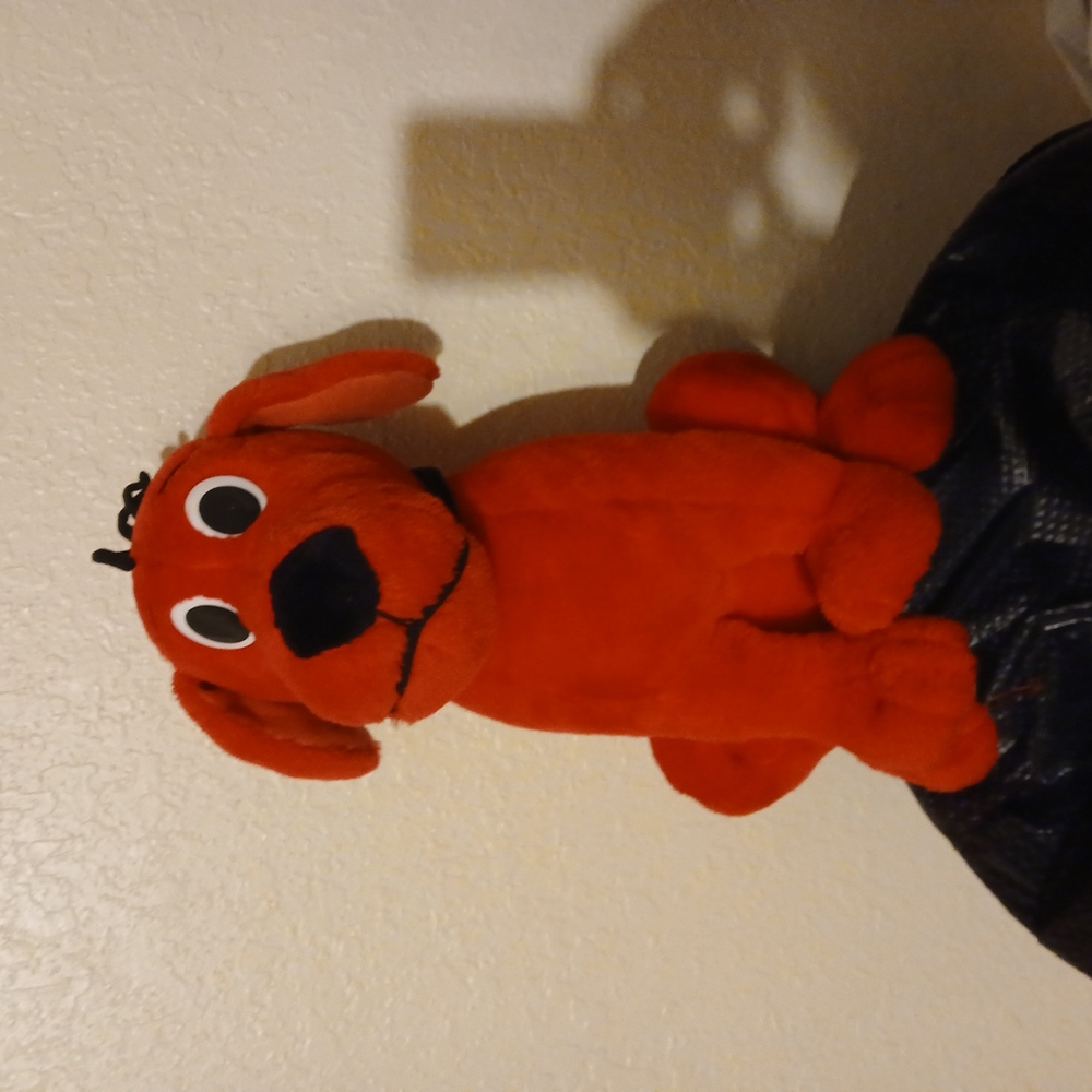 Red Plush Stuffed Animal with Cartoon Eyes